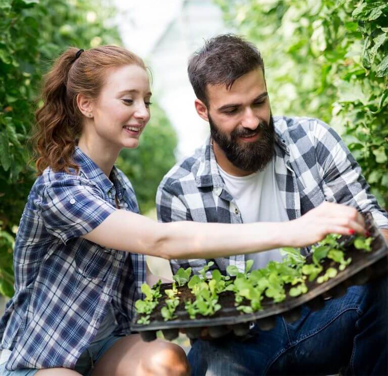 Young woman and man in a garden