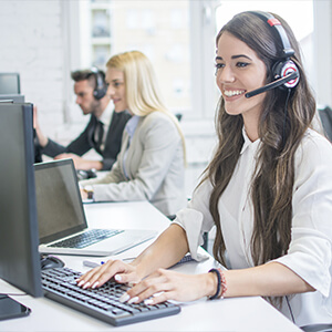 Professional sitting at her computer answering support calls