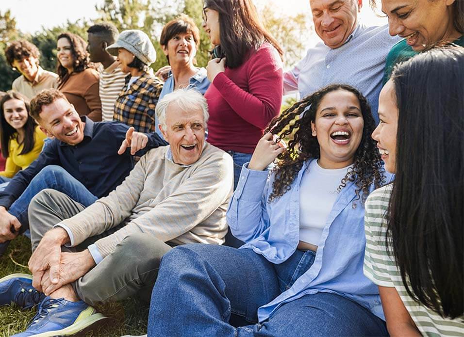 Group of multigenerational people having fun together outside
