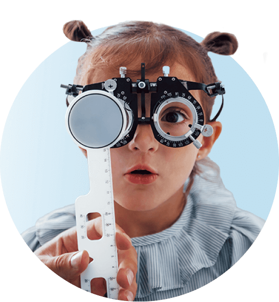 Cute little girl in piggy tails getting her eyes checked at eye doctor's office