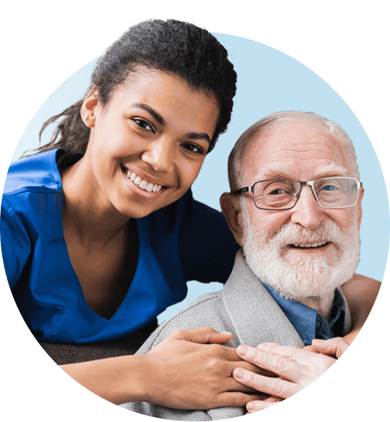 Infusion nurse hugging older patient in glasses smiling