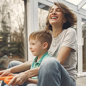 Young boy and mom playing