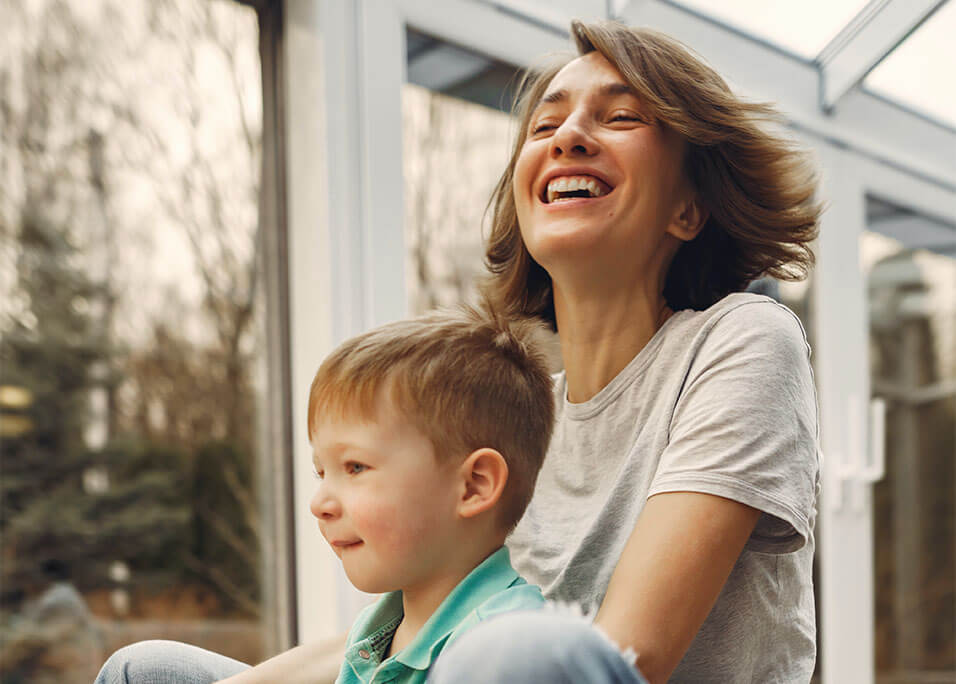 Boy and mom playing outdoors